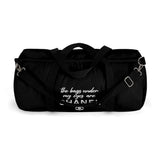 The bags under my eyes are CHA NEL Duffel Bag